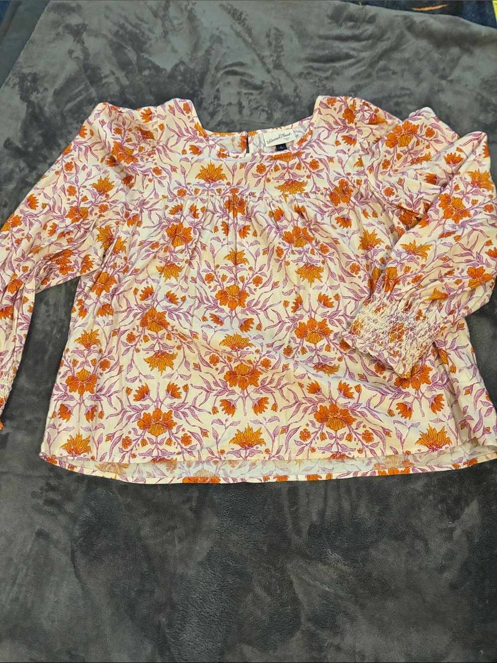 Universal Thread Floral Peasant Blouse in Orange & Pink. Smocked cuffs